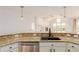 Modern kitchen featuring granite countertops, stainless steel appliances, and open concept layout at 8525 E 149Th Dr, Thornton, CO 80602