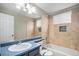 Bathroom featuring a single sink with tub and shower at 613 Rio Rancho Way, Brighton, CO 80601