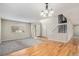 Spacious living room featuring hardwood floors, staircase, and natural light, creating a welcoming atmosphere at 613 Rio Rancho Way, Brighton, CO 80601