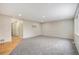 Large living room featuring hardwood floors, cozy carpeting, and lots of space for entertaining at 613 Rio Rancho Way, Brighton, CO 80601