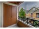 Balcony featuring a storage closet and view of nearby townhomes at 7130 Simms St # 206, Arvada, CO 80004