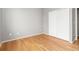 Bright bedroom with hardwood floors and closet with double doors at 7130 Simms St # 206, Arvada, CO 80004