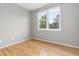 Bedroom featuring a window with a view of the trees at 7130 Simms St # 206, Arvada, CO 80004