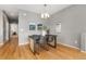 Dining room featuring modern table with seating and hardwood floors at 7130 Simms St # 206, Arvada, CO 80004