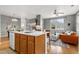 Spacious living room features an island, and seamlessly connects with a cozy living area at 7130 Simms St # 206, Arvada, CO 80004