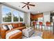 A stylish living room showcases seamless integration with the kitchen at 7130 Simms St # 206, Arvada, CO 80004