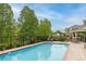Community pool featuring a jacuzzi and lounge chairs; a perfect area to relax at 7130 Simms St # 206, Arvada, CO 80004