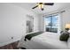 Bright bedroom with a bed, sliding glass door, and a view of the balcony and the sky at 8701 Huron St # 1-212, Thornton, CO 80260