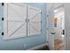 Bedroom features barn-style closet doors, hardwood floors, and an adjacent doorway at 8701 Huron St # 1-212, Thornton, CO 80260