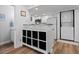 Eat-in kitchen with granite countertops, white cabinets, stainless appliances and adjacent laundry closet at 8701 Huron St # 1-212, Thornton, CO 80260