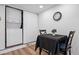 Close up on a small dining set next to a white stacked washer and dryer unit at 8701 Huron St # 1-212, Thornton, CO 80260