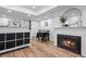 Charming living room features a fireplace, dining area, and an open floor plan with hardwood flooring at 8701 Huron St # 1-212, Thornton, CO 80260