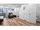 This cozy living room features hardwood floors, white walls, modern furnishings and plenty of natural light at 8701 Huron St # 1-212, Thornton, CO 80260