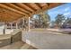 View of backyard space with wooden pergola showing patio and well-maintained landscaping at 2700 S Holly St # 107, Denver, CO 80222