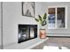 Close-up of the fireplace with decorative brick and stylish decor at 2700 S Holly St # 107, Denver, CO 80222