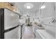 Bright kitchen with stainless steel appliances and a laundry area at 2700 S Holly St # 107, Denver, CO 80222