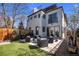 A modern backyard with an outdoor patio, a turf yard, a grill, an outdoor seating and a modern exterior at 2305 Quitman St, Denver, CO 80212