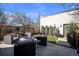 An outdoor patio with stylish seating, turf and a fenced yard is perfect for enjoying the outdoors at 2305 Quitman St, Denver, CO 80212