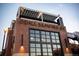 The brick exterior of Odell Brewing Company, including the outdoor roof deck at 2305 Quitman St, Denver, CO 80212