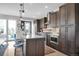 Gourmet kitchen featuring a center island, stainless steel appliances, and custom cabinetry at 2305 Quitman St, Denver, CO 80212