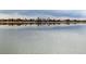 Scenic view of the city skyline reflected in the calm lake waters at 2305 Quitman St, Denver, CO 80212