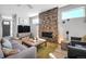 Comfortable living room with stone fireplace, modern furniture, and natural light at 2305 Quitman St, Denver, CO 80212
