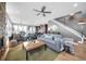 Open-concept living room with a cozy fireplace, hardwood floors, and modern decor at 2305 Quitman St, Denver, CO 80212