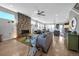 Bright, open living space featuring a floor to ceiling stone fireplace and modern finishes at 2305 Quitman St, Denver, CO 80212
