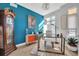 Bright office with hardwood floors, zebra art, colorful accents, and natural light at 2305 Quitman St, Denver, CO 80212