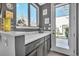 Butler's pantry featuring a sleek countertop, undermount sink, and ample cabinetry for storage, and outdoor access at 2305 Quitman St, Denver, CO 80212