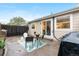 Cozy backyard patio area featuring a dining set and a stylish outdoor rug at 2985 W 46Th Ave, Denver, CO 80211