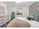 Inviting bedroom features bright wallpaper, lots of pillows, and natural light, creating a relaxing retreat at 2985 W 46Th Ave, Denver, CO 80211