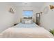 Serene bedroom with simple decor, a gold frame bed, and soft bedding, offering a restful ambiance at 2985 W 46Th Ave, Denver, CO 80211