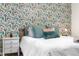 Tastefully decorated bedroom with patterned wallpaper and neutral bedding, ideal for a peaceful rest at 2985 W 46Th Ave, Denver, CO 80211