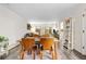 Well-lit dining room features a wooden table with chairs and seamlessly connects to the living space at 2985 W 46Th Ave, Denver, CO 80211