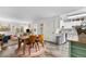 Open living space with modern finishes features a dining area, updated kitchen and sliding doors to the backyard at 2985 W 46Th Ave, Denver, CO 80211