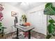 Charming home office featuring a modern desk, lush plants, and a cozy rug on sleek wood flooring at 2985 W 46Th Ave, Denver, CO 80211