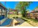 Cozy outdoor seating area with an umbrella, perfect for relaxing and entertaining in the backyard at 2852 W Ellsworth Ave, Denver, CO 80219