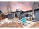 Cozy backyard with a wooden fence, outdoor seating, and beautiful sunset views at 2852 W Ellsworth Ave, Denver, CO 80219