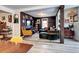 Well-lit living room with open space and modern flooring at 2852 W Ellsworth Ave, Denver, CO 80219