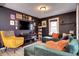 Cozy living room with a unique color scheme, modern flooring and ample natural light at 2852 W Ellsworth Ave, Denver, CO 80219