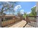 Spacious wooden back deck featuring wood railing with steps leading down to the yard at 17476 E Bellewood Cir, Aurora, CO 80015