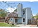 View of home's backyard with deck, artificial turf, and blue vinyl siding at 17476 E Bellewood Cir, Aurora, CO 80015