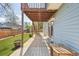 Exterior view of a backyard with patio, turf, and second story deck at 17476 E Bellewood Cir, Aurora, CO 80015