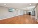Finished basement offers wood floors, recessed lighting, mounted tv, and plenty of living space at 17476 E Bellewood Cir, Aurora, CO 80015