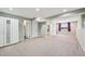 This large finished basement features neutral carpet and light gray walls at 17476 E Bellewood Cir, Aurora, CO 80015