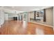 Finished basement space with wood floors, sliding glass doors to the outside, and a wet bar area at 17476 E Bellewood Cir, Aurora, CO 80015