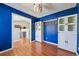 Bright blue dining room with modern cabinets and stylish light fixture at 17476 E Bellewood Cir, Aurora, CO 80015