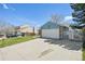 Long driveway leading to a two-car garage, plus mature trees around the property at 17476 E Bellewood Cir, Aurora, CO 80015