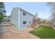 View of house with blue siding, a deck and walkway leading to the back of the property at 17476 E Bellewood Cir, Aurora, CO 80015